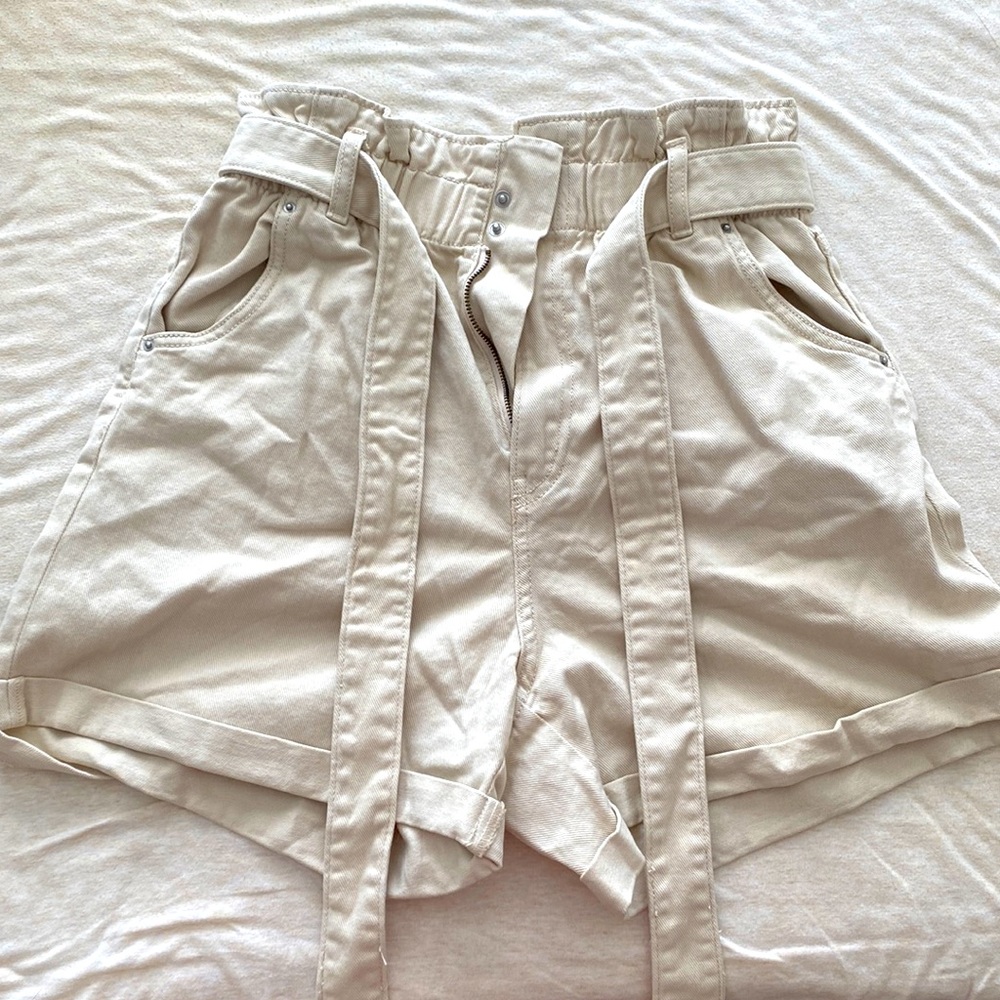 H&M Beige paper bag shorts.